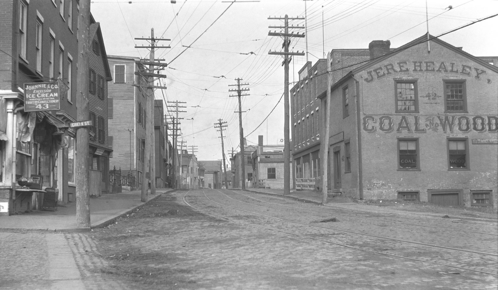 Merrimac Street at Green Street with the factory behind the coal building