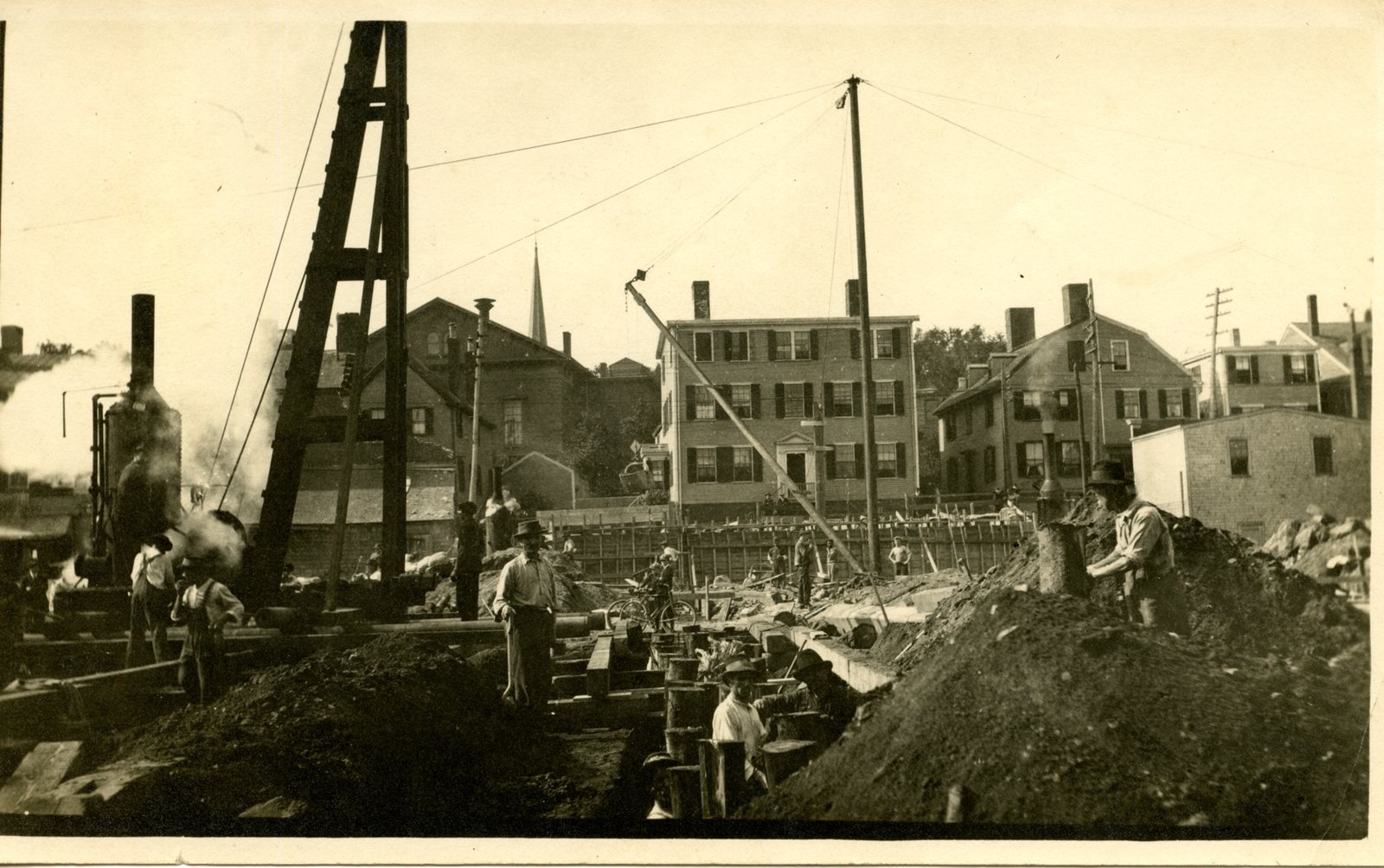 Foundation work with steam pile driver, August 1915