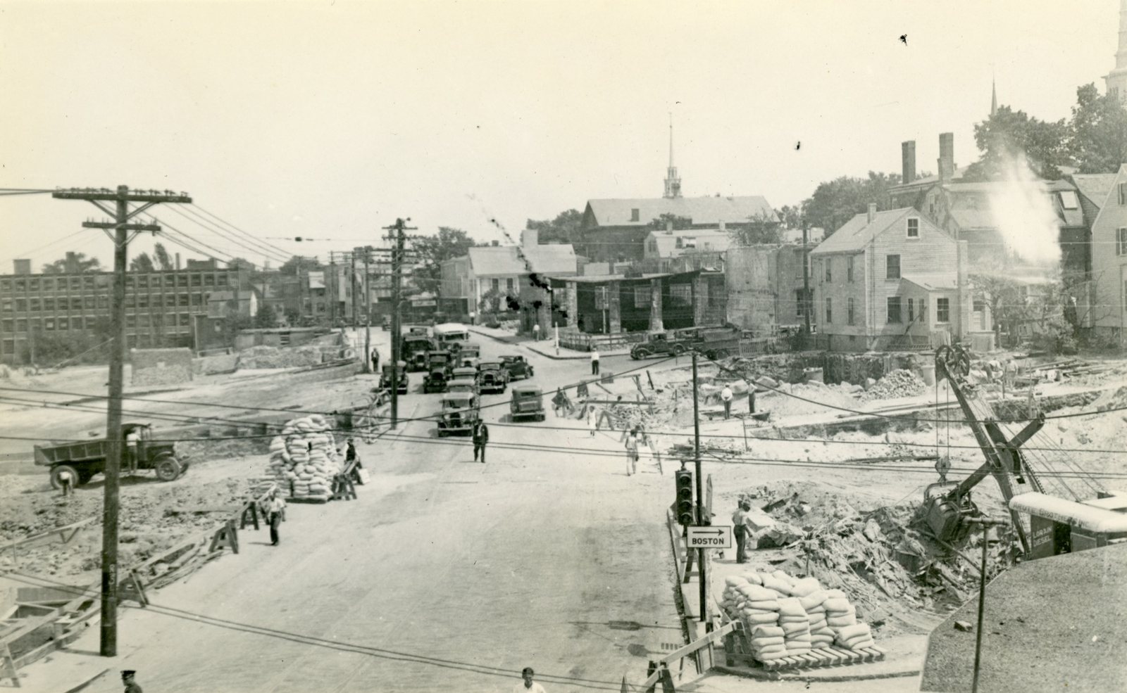 Steam shovel clearing the burned blocks along Merrimac Street