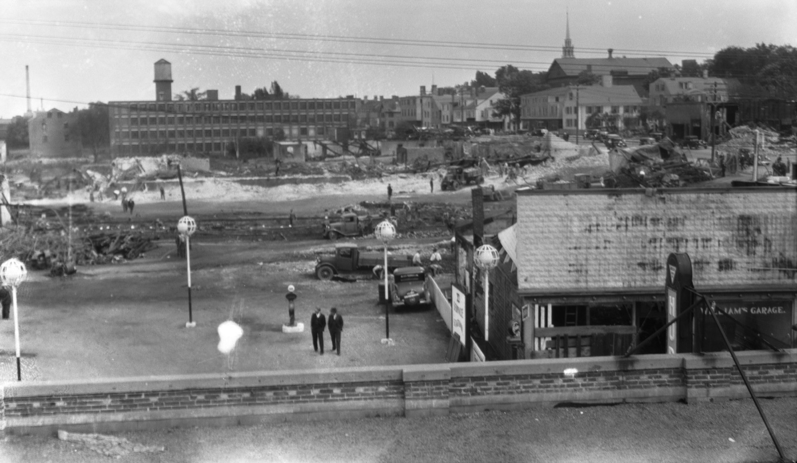 The leveled neighborhood after the fire, with Factory No. 3 standing intact in the background