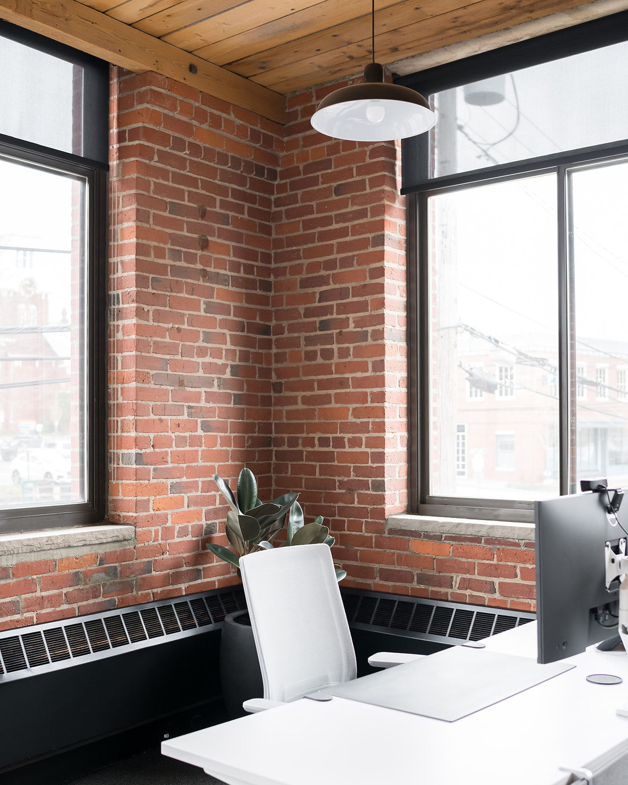 Private office with exposed brick